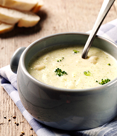 Creamy cauliflower-broccoli soup with brie