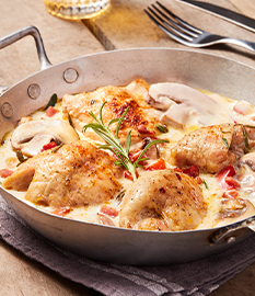 Casserole of chicken thighs in a creamy cheese-garlic sauce