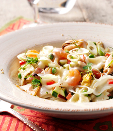 Farfalle with shellfish, peppers, courgette and a light cheese sauce