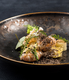 Ravioli with extra aged cheese, langoustines and winter truffle