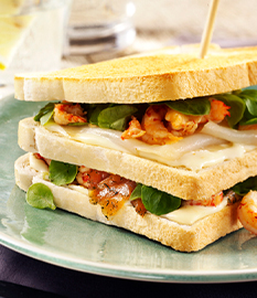 Club sandwich with salmon, crayfish, halibut and Gouda cheese spread light