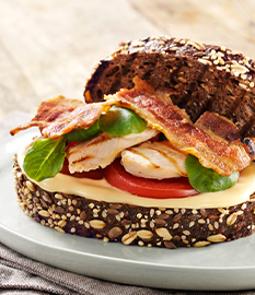 BLT Sandwich with grilled corn-fed chicken and melted aged cheese