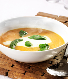 Pumpkin soup with goat’s cheese and chive oil