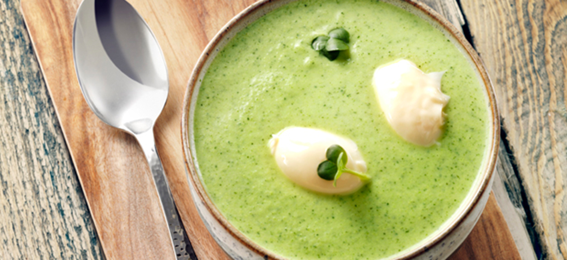 Courgette soup with a creamy brie topping