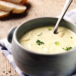 Creamy cauliflower-broccoli soup with brie