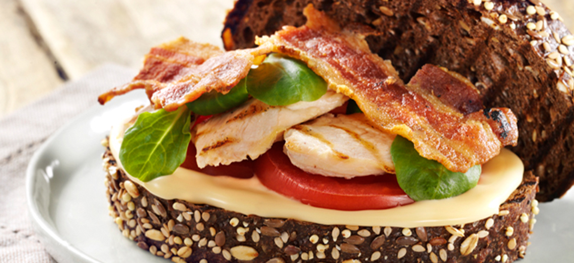 BLT Sandwich with grilled corn-fed chicken and melted aged cheese