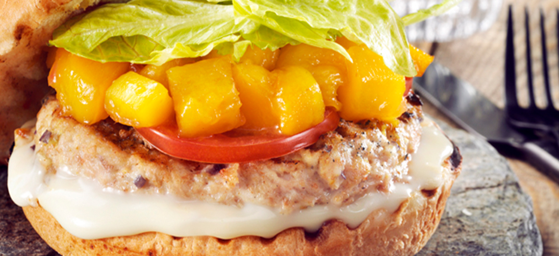 Chicken burger with Gouda cheese and mango chutney