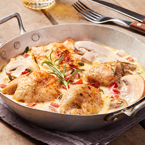 Casserole of chicken thighs in a creamy cheese-garlic sauce