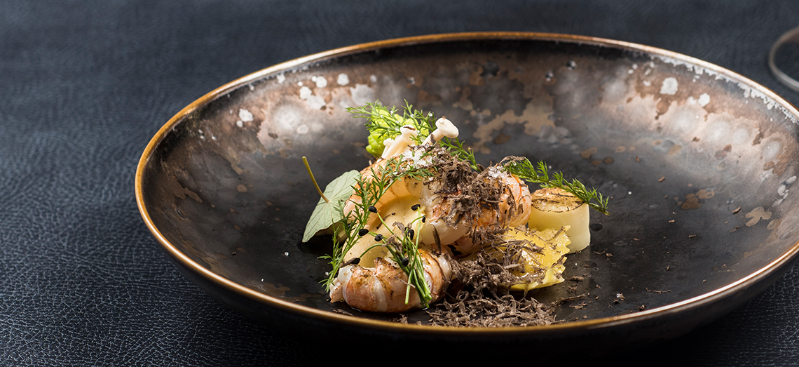 Ravioli with extra aged cheese, langoustines and winter truffle