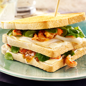 Club sandwich with salmon, crayfish, halibut and Gouda cheese spread light