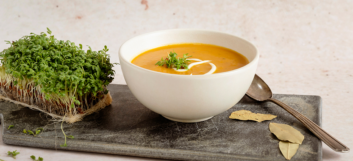Squash soup with a creamy brie topping