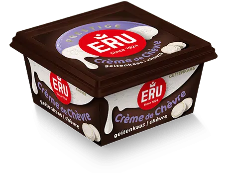 Zijdezachte wortel-prei soep met een swirl van geitenkaas