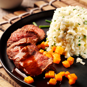 Risotto met roomzachte Goudse kaas, pompoen en biefstuk